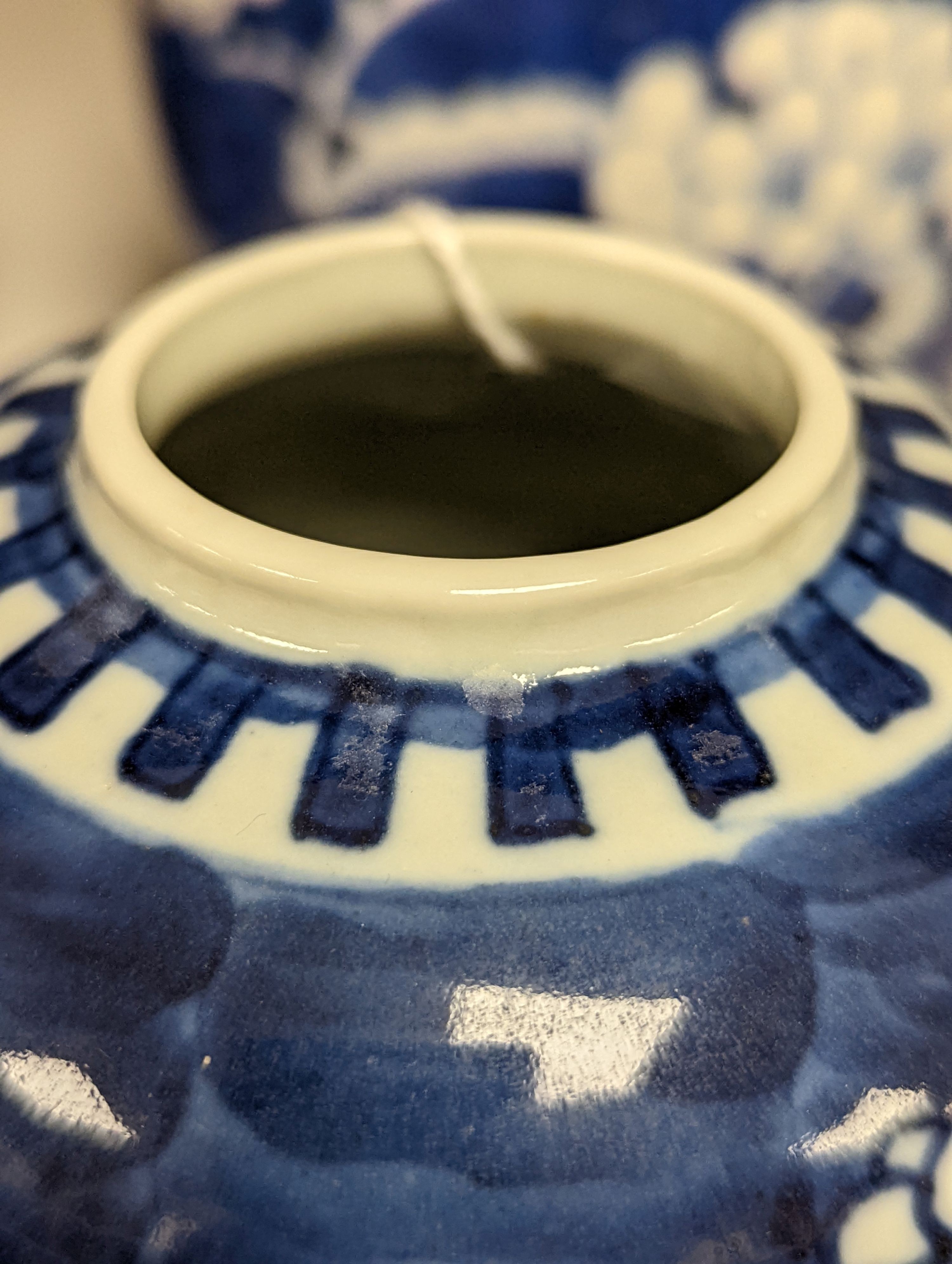 Three 19th century graduated Chinese blue and white ginger jars and covers